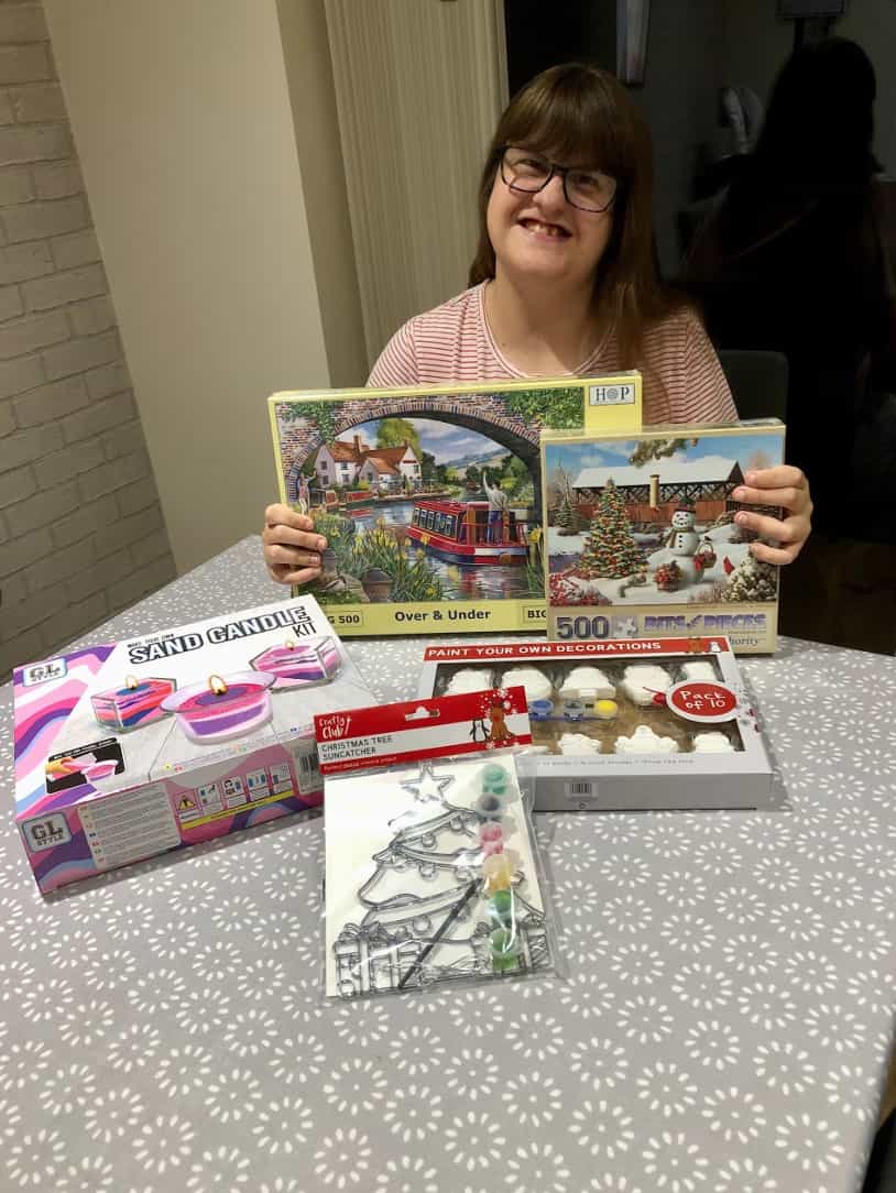 An image of Lucy who used her personal health budget to buy jigsaws and craft activities to prevent her from becoming low during the winter months.